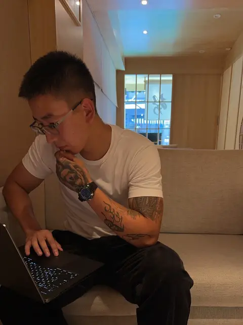 Yo-Da working on his laptop